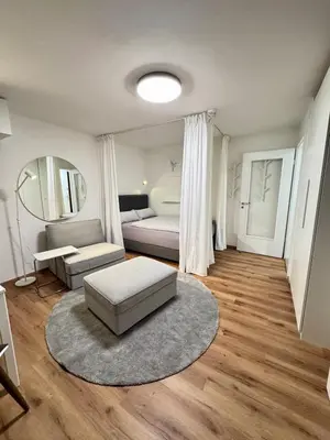 Ein Bett oder Betten in einem Zimmer der Unterkunft InnStyle FeWo Rosenheim