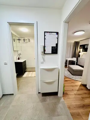 Ein Bett oder Betten in einem Zimmer der Unterkunft InnStyle FeWo Rosenheim