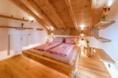Ein Bett oder Betten in einem Zimmer der Unterkunft Bergliebe
