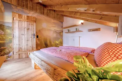 Ein Bett oder Betten in einem Zimmer der Unterkunft Bergliebe