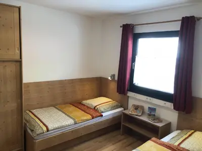 Ein Bett oder Betten in einem Zimmer der Unterkunft Ferienhaus-31 in Lechbruck am See, 4 Sterne zertifiziert, Allgäu