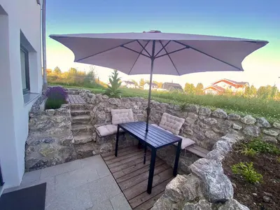Ein Patio oder anderer Außenbereich in der Unterkunft Gemütliche Oase im Voralpenland