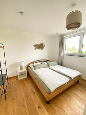 Ein Bett oder Betten in einem Zimmer der Unterkunft Gemütliche Oase im Voralpenland