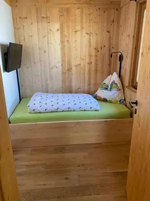 Ein Bett oder Betten in einem Zimmer der Unterkunft Chalet Obstblüte