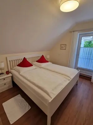 Ein Bett oder Betten in einem Zimmer der Unterkunft Haus am Mühlenweg - modern und lichtdurchflutet