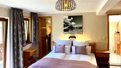 Ein Bett oder Betten in einem Zimmer der Unterkunft Kölbl Apartments - Ferienwohnungen am Tegernsee