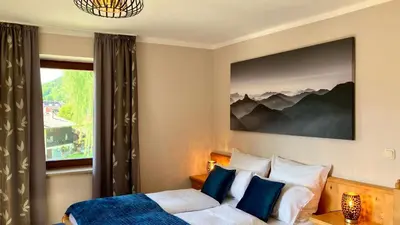 Ein Bett oder Betten in einem Zimmer der Unterkunft Kölbl Apartments - Ferienwohnungen am Tegernsee