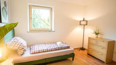 Ein Bett oder Betten in einem Zimmer der Unterkunft Papyrer Apartment - Stilvolles Apartment in Lenggries