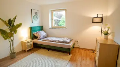 Ein Bett oder Betten in einem Zimmer der Unterkunft Papyrer Apartment - Stilvolles Apartment in Lenggries