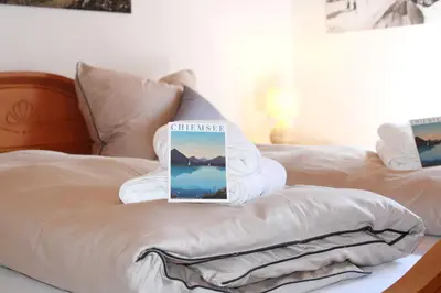 Ein Bett oder Betten in einem Zimmer der Unterkunft See & Bergliebe