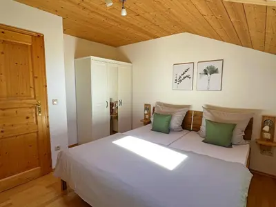Ein Bett oder Betten in einem Zimmer der Unterkunft Ferienwohnung Göttersberg