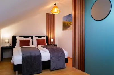 Ein Bett oder Betten in einem Zimmer der Unterkunft ThermenNest Erding, parking, wifi