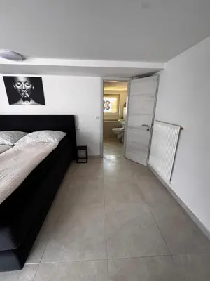 Ein Bett oder Betten in einem Zimmer der Unterkunft Stadt Apartments Bade
