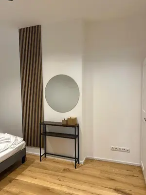 Ein Bett oder Betten in einem Zimmer der Unterkunft SeeZeit bis zu 4 Personen zentral in Prien am Chiemsee