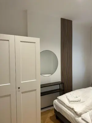 Ein Bett oder Betten in einem Zimmer der Unterkunft SeeZeit bis zu 4 Personen zentral in Prien am Chiemsee