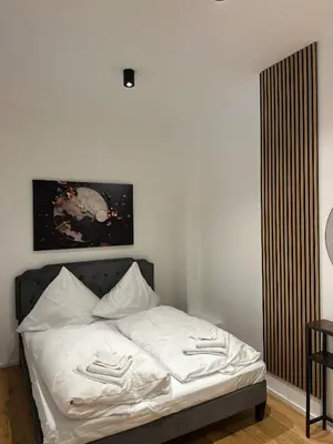 Ein Bett oder Betten in einem Zimmer der Unterkunft SeeZeit bis zu 4 Personen zentral in Prien am Chiemsee