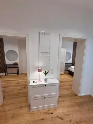 Ein Bett oder Betten in einem Zimmer der Unterkunft SeeZeit bis zu 4 Personen zentral in Prien am Chiemsee