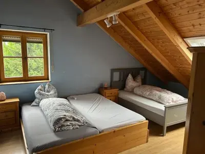 Ein Bett oder Betten in einem Zimmer der Unterkunft Unterkunft in Anzing - DG - 90 qm