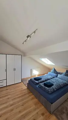 Ein Bett oder Betten in einem Zimmer der Unterkunft Ferienwohnung Chiemsee