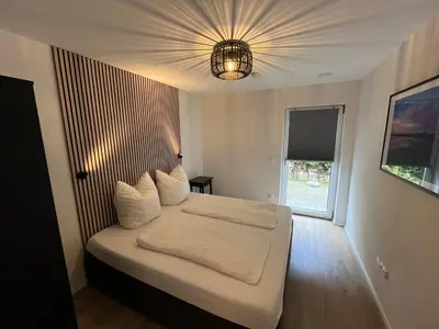 Ein Bett oder Betten in einem Zimmer der Unterkunft Ferienwohnung Osternach