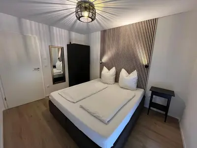Ein Bett oder Betten in einem Zimmer der Unterkunft Ferienwohnung Osternach