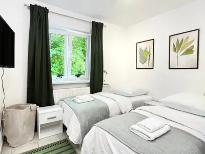 Ein Bett oder Betten in einem Zimmer der Unterkunft LTA Apartment Ingolstadt Irgertsheim-5 Schlafzimmer-Einzelbetten-WLAN-Waschmaschine