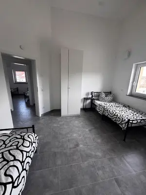 Ein Bett oder Betten in einem Zimmer der Unterkunft Steinhöring Bade Appartements
