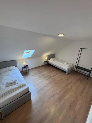 Ein Bett oder Betten in einem Zimmer der Unterkunft Bavaria Home Apartments