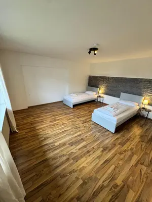 Ein Bett oder Betten in einem Zimmer der Unterkunft Bavaria Home Apartments