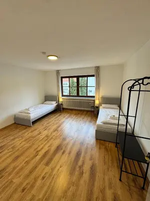 Ein Bett oder Betten in einem Zimmer der Unterkunft Bavaria Home Apartments