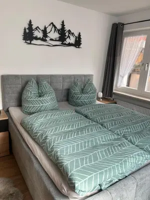 Ein Bett oder Betten in einem Zimmer der Unterkunft Ferienwohnung Dauberweiß