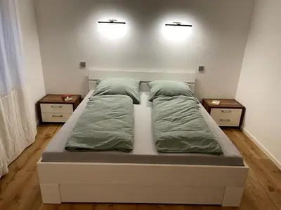 Ein Bett oder Betten in einem Zimmer der Unterkunft Ferienwohnung in Unterwössen
