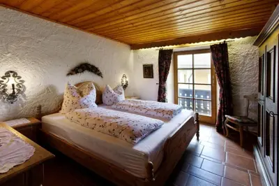 Ein Bett oder Betten in einem Zimmer der Unterkunft Hölzlhaus -563-