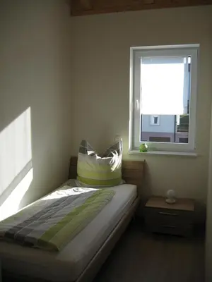 Ein Bett oder Betten in einem Zimmer der Unterkunft Ferienhaus Staudensonne