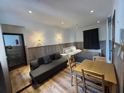 Ein Sitzbereich in der Unterkunft GG Self-Stay