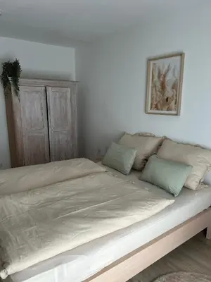 Ein Bett oder Betten in einem Zimmer der Unterkunft Ferienwohnung am Wendelstein
