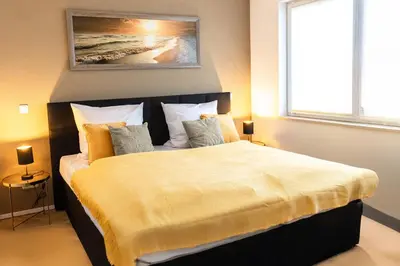 Ein Bett oder Betten in einem Zimmer der Unterkunft wolke 7, Alpenblick mit Eleganz