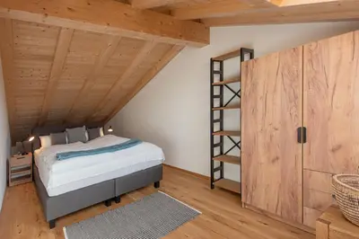 Ein Bett oder Betten in einem Zimmer der Unterkunft Ferienhaus Chiemseefeeling
