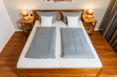 Ein Bett oder Betten in einem Zimmer der Unterkunft ARTHOTEL Herrsching