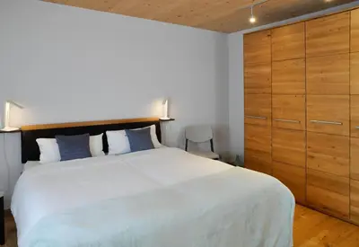 Ein Bett oder Betten in einem Zimmer der Unterkunft Ammersee Lodge