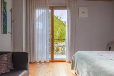 Ein Bett oder Betten in einem Zimmer der Unterkunft Ammersee Lodge