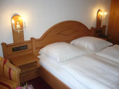 Ein Bett oder Betten in einem Zimmer der Unterkunft Alpenhotel Pfaffenwinkel