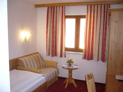 Ein Bett oder Betten in einem Zimmer der Unterkunft Alpenhotel Pfaffenwinkel