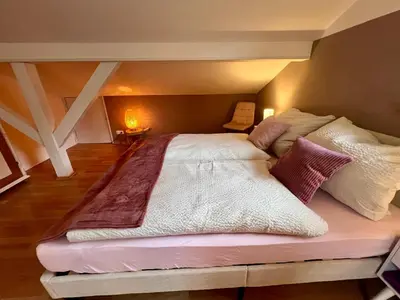 Ein Bett oder Betten in einem Zimmer der Unterkunft Room with a Skylight - gemütliches Zimmer zwischen München und Rosenheim