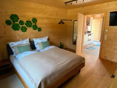 Ein Bett oder Betten in einem Zimmer der Unterkunft NaturWohnRaum - Urlaub im Holzhaus