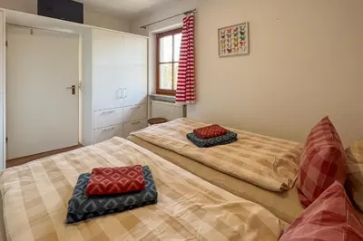 Ein Bett oder Betten in einem Zimmer der Unterkunft Chiemsee Auszeit