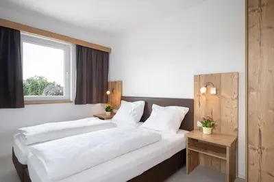 Ein Bett oder Betten in einem Zimmer der Unterkunft snooze apartments Holzkirchen