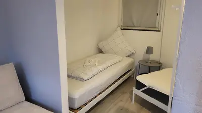 Ein Bett oder Betten in einem Zimmer der Unterkunft Apartment West