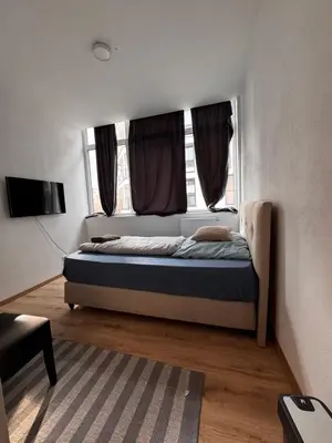 Ein Bett oder Betten in einem Zimmer der Unterkunft A&B Ferienwohnungen