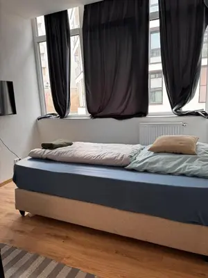 Ein Bett oder Betten in einem Zimmer der Unterkunft A&B Ferienwohnungen